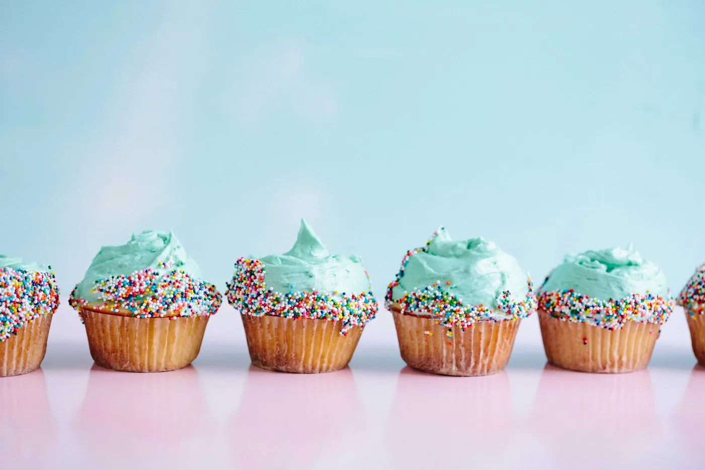 A trio of beautifully frosted cupcakes